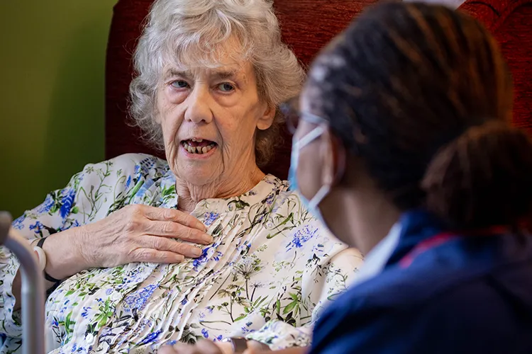 Resident talking to care worker