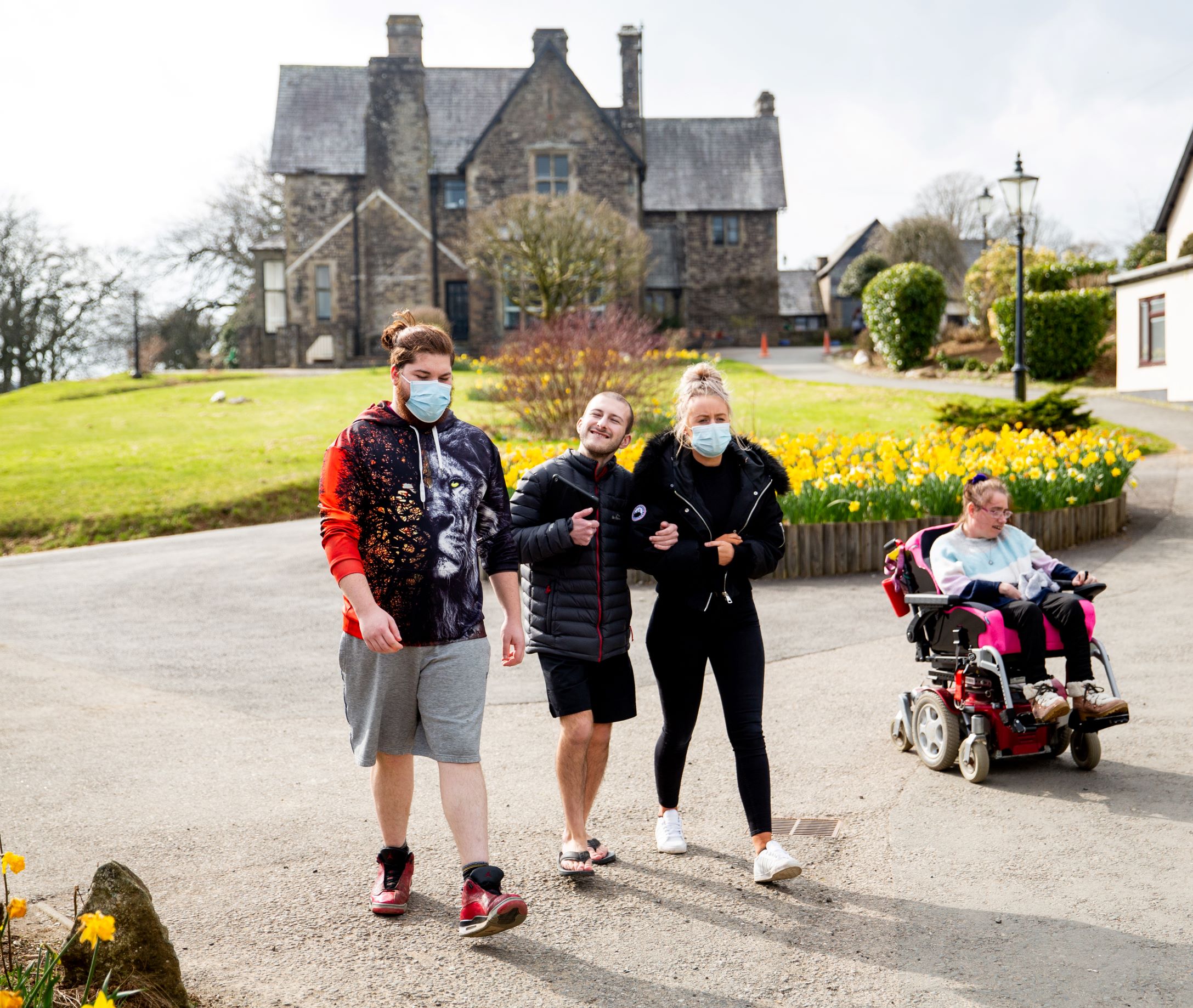 Support workers and service users going for a walk